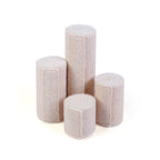 Set of four elastic bandages on a white background